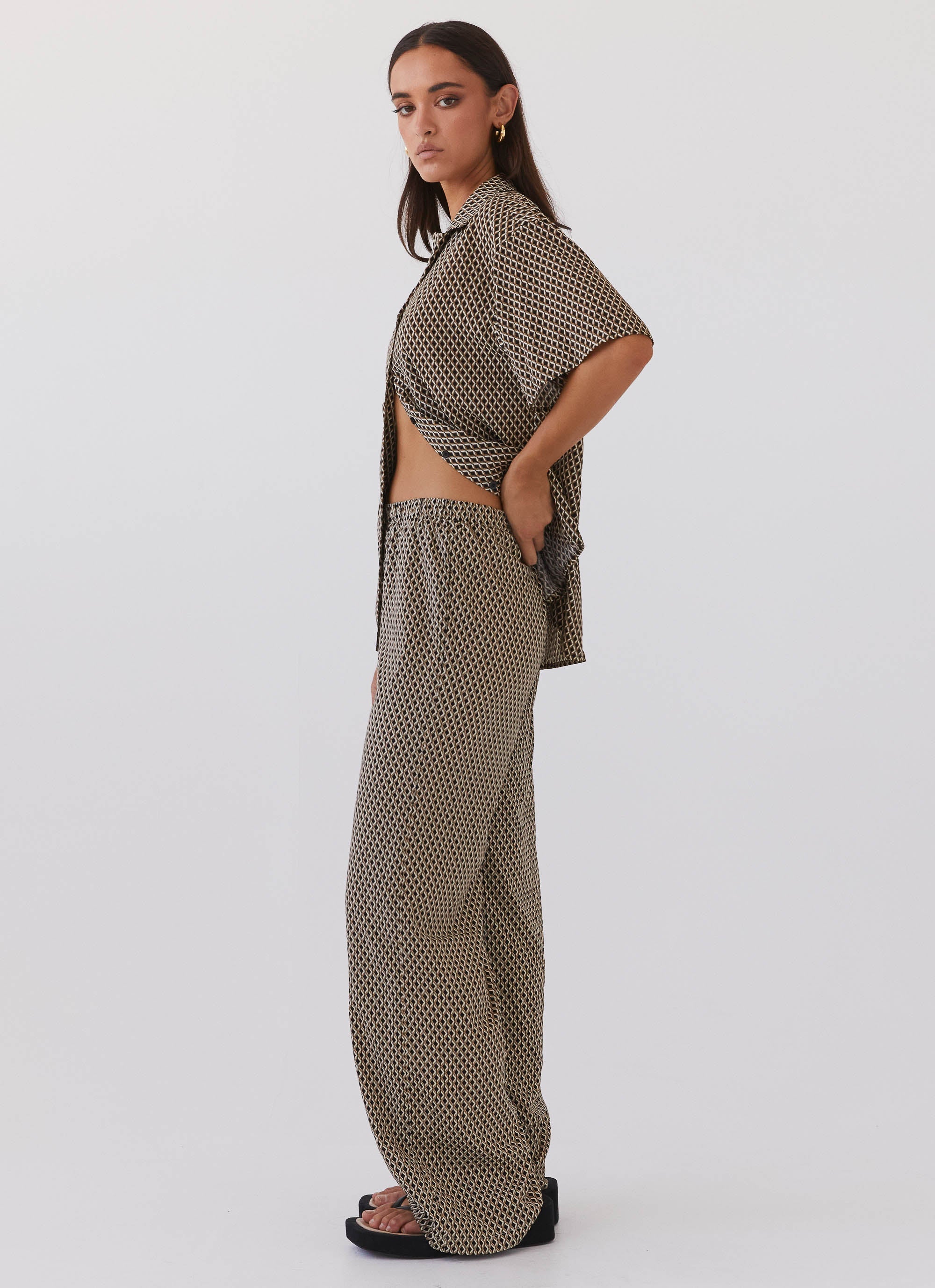 Womens Bruno Wide Leg Pants in the colour Brown Geo in front of a light grey background