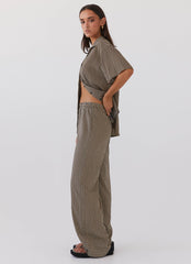 Womens Bruno Wide Leg Pants in the colour Brown Geo in front of a light grey background