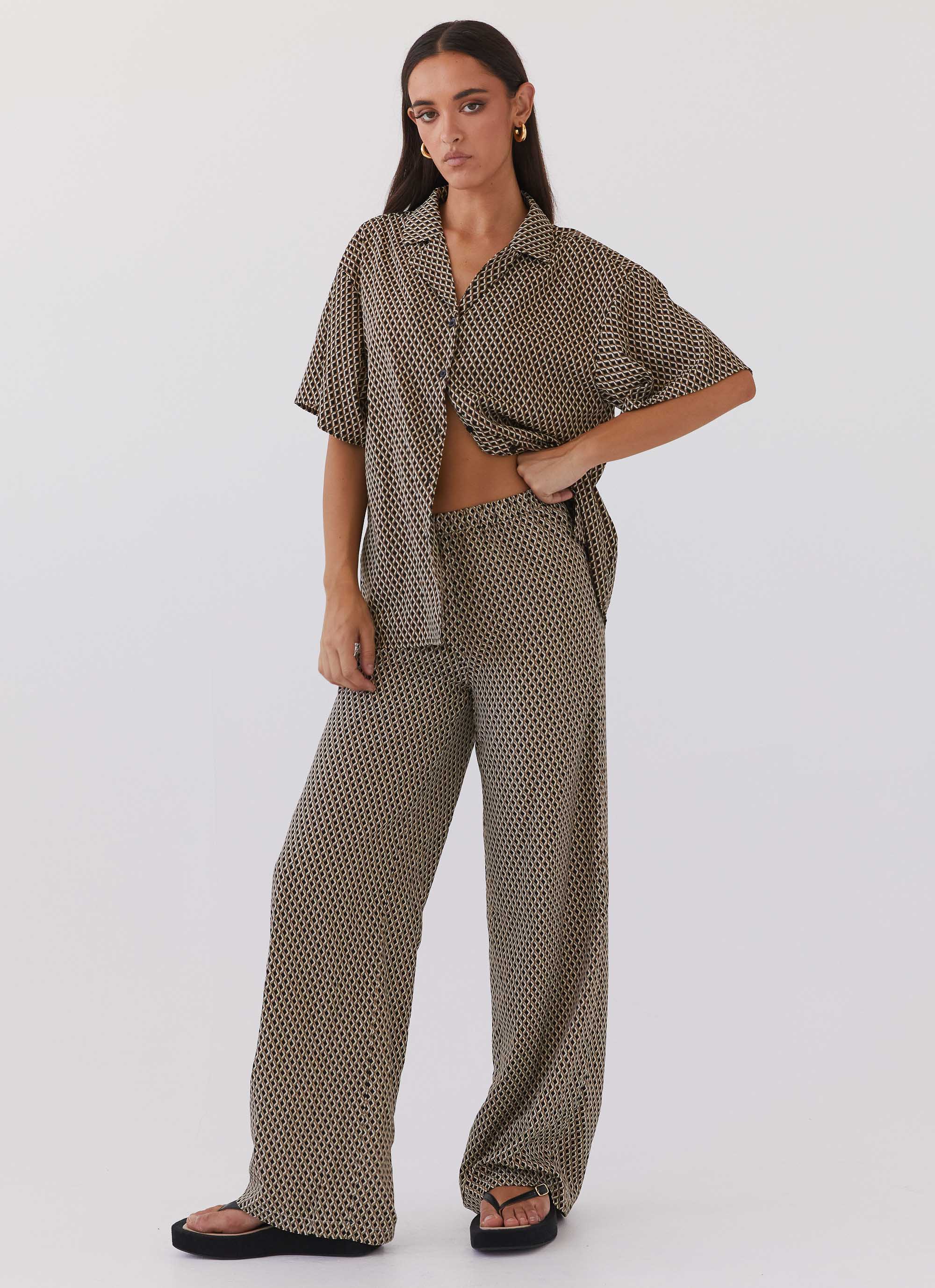 Womens Bruno Wide Leg Pants in the colour Brown Geo in front of a light grey background