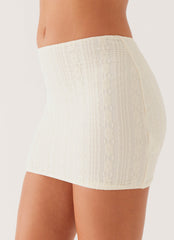 Womens Easy On The Heart Low Rise Mini Skirt in the colour Ivory in front of a light grey background