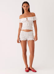 Womens Girls Like Us Ruched Mini Shorts in the colour White in front of a light grey background