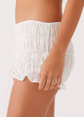 Womens Girls Like Us Ruched Mini Shorts in the colour White in front of a light grey background