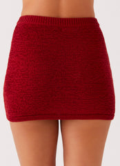 Womens Capri Glow Knit Skirt in the colour Maroon in front of a light grey background