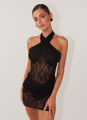 Womens Santana Crossover Lace Mini Dress in the colour Black in front of a light grey background