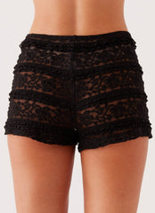 Womens Desert Isle Mini Shorts in the colour Black in front of a light grey background