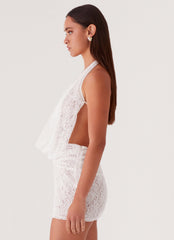 Womens Elysia Lace Mini Dress in the colour White in front of a light grey background