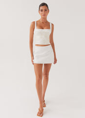 Womens Sylvia Satin Mini Skirt in the colour Ivory in front of a light grey background