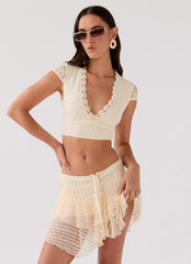 Womens Coconut Cove Mini Skirt in the colour Ivory in front of a light grey background