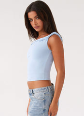Womens Solace Soul Twist Shoulder Top in the colour Baby Blue in front of a light grey background