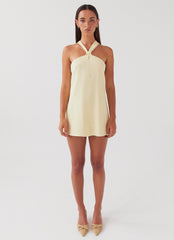 Womens Keira Linen Mini Dress in the colour Lemon in front of a light grey background