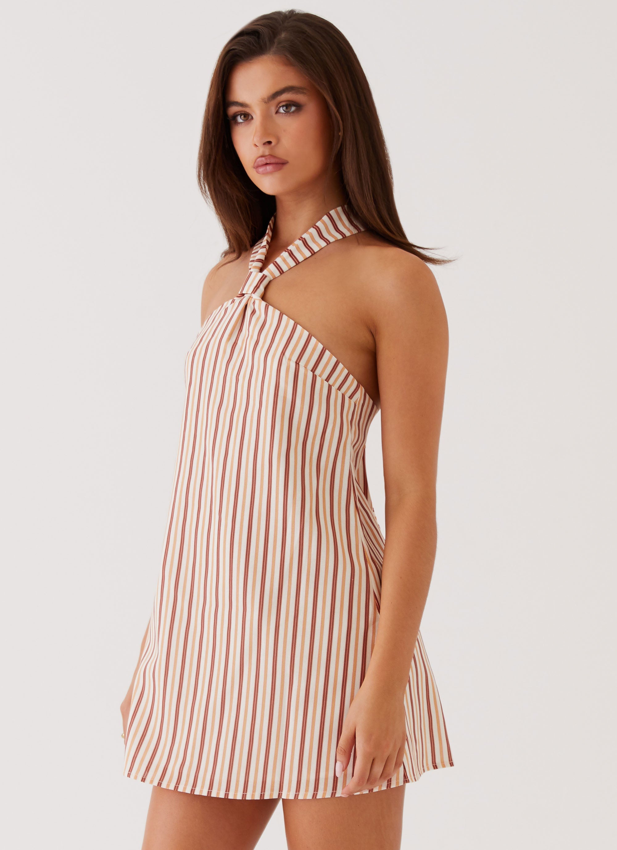 Womens Keira Linen Mini Dress in the colour Passionfruit Stripe in front of a light grey background