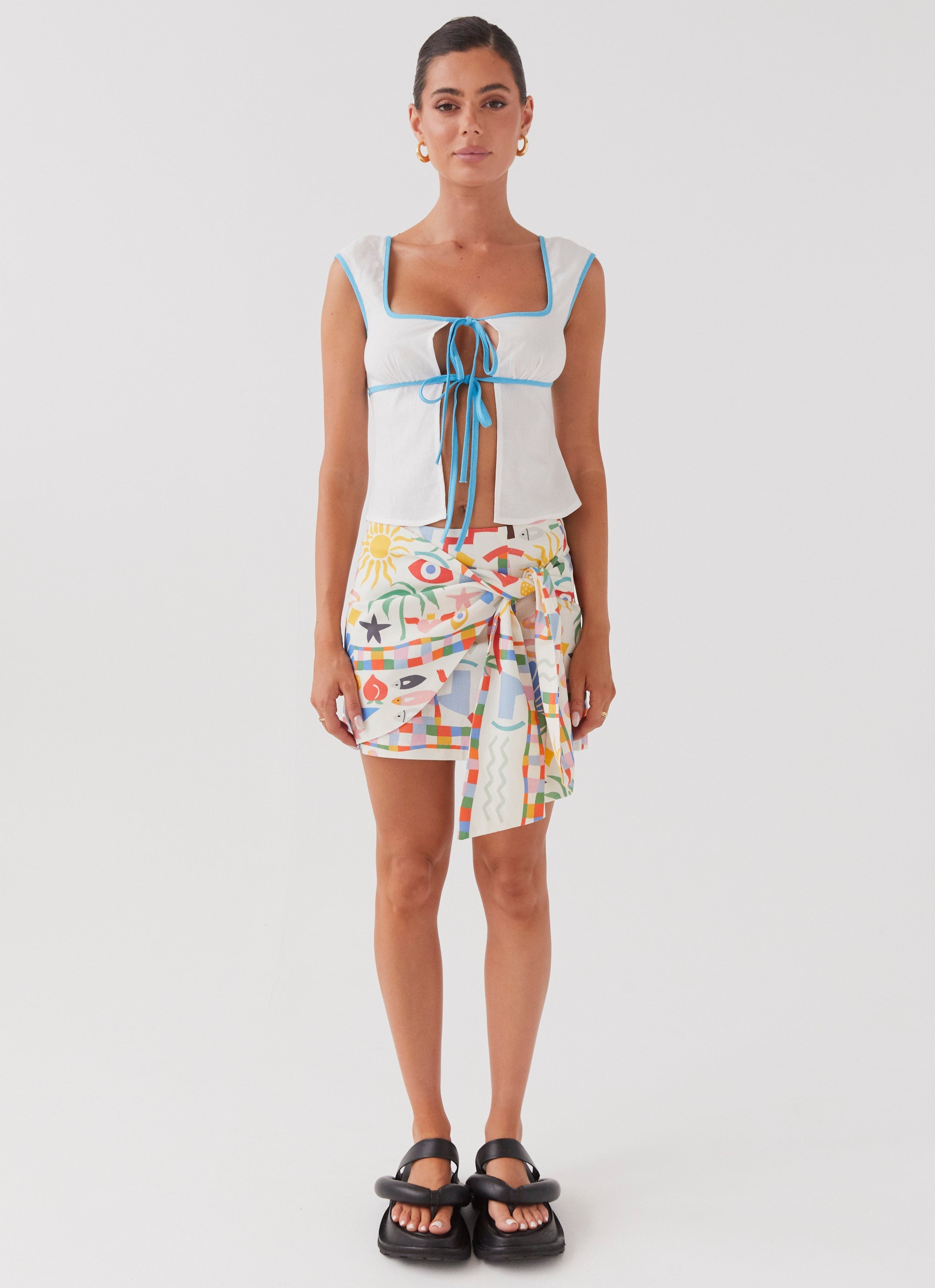 Womens At First Light Linen Wrap Mini Skirt in the colour Summer Palm in front of a light grey background