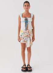 Womens At First Light Linen Wrap Mini Skirt in the colour Summer Palm in front of a light grey background