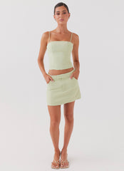 Womens Eliana Suit Mini Skirt in the colour Green Zest in front of a light grey background