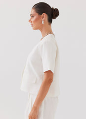 Womens Hacienda Linen Short Sleeve Blazer in the colour White in front of a light grey background