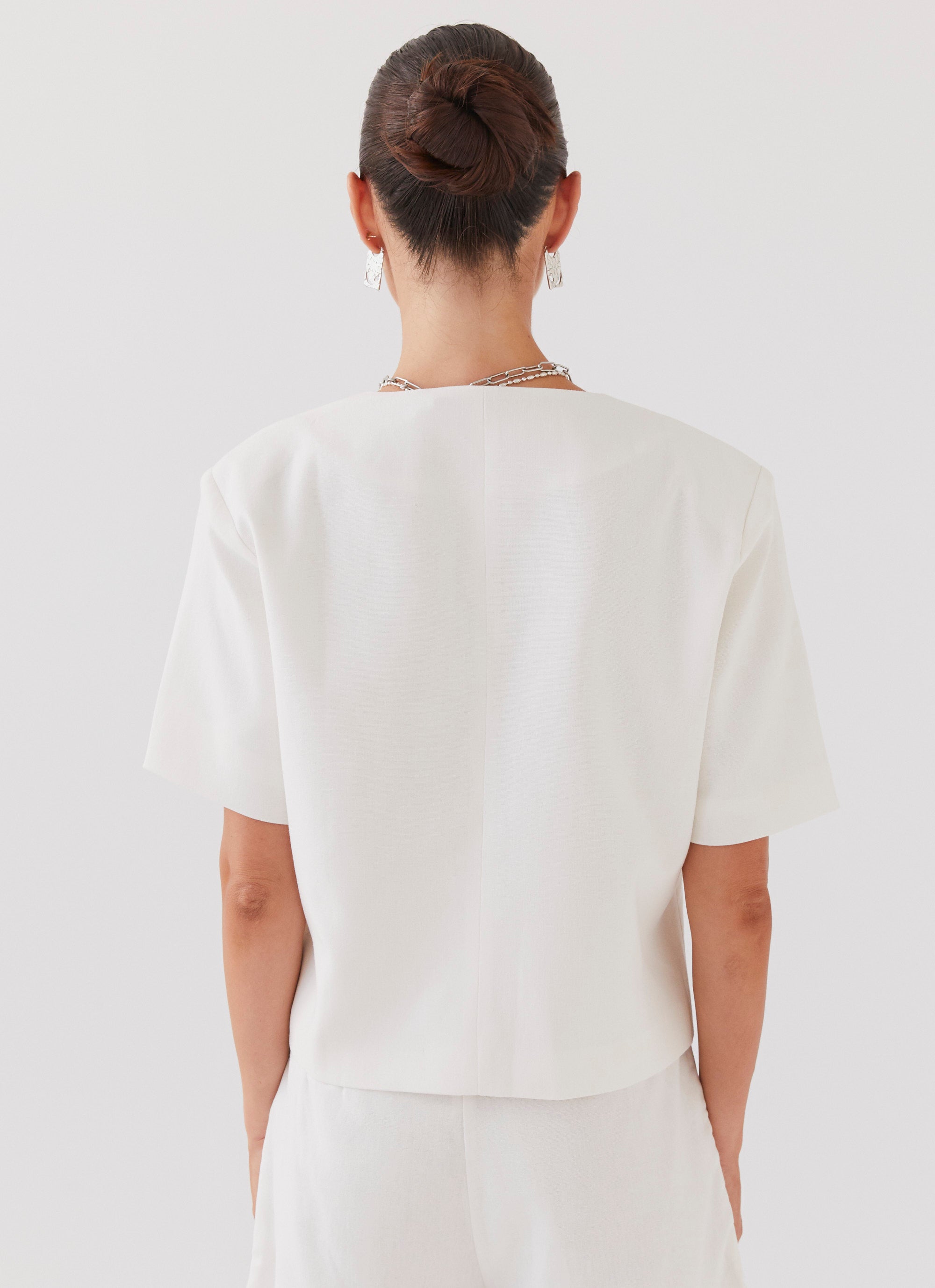 Womens Hacienda Linen Short Sleeve Blazer in the colour White in front of a light grey background