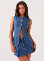 Womens Ashlyn Denim Mini Skirt in the colour Indigo in front of a light grey background