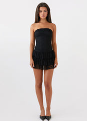 Womens Posie Lace Tube Mini Dress in the colour Black in front of a light grey background