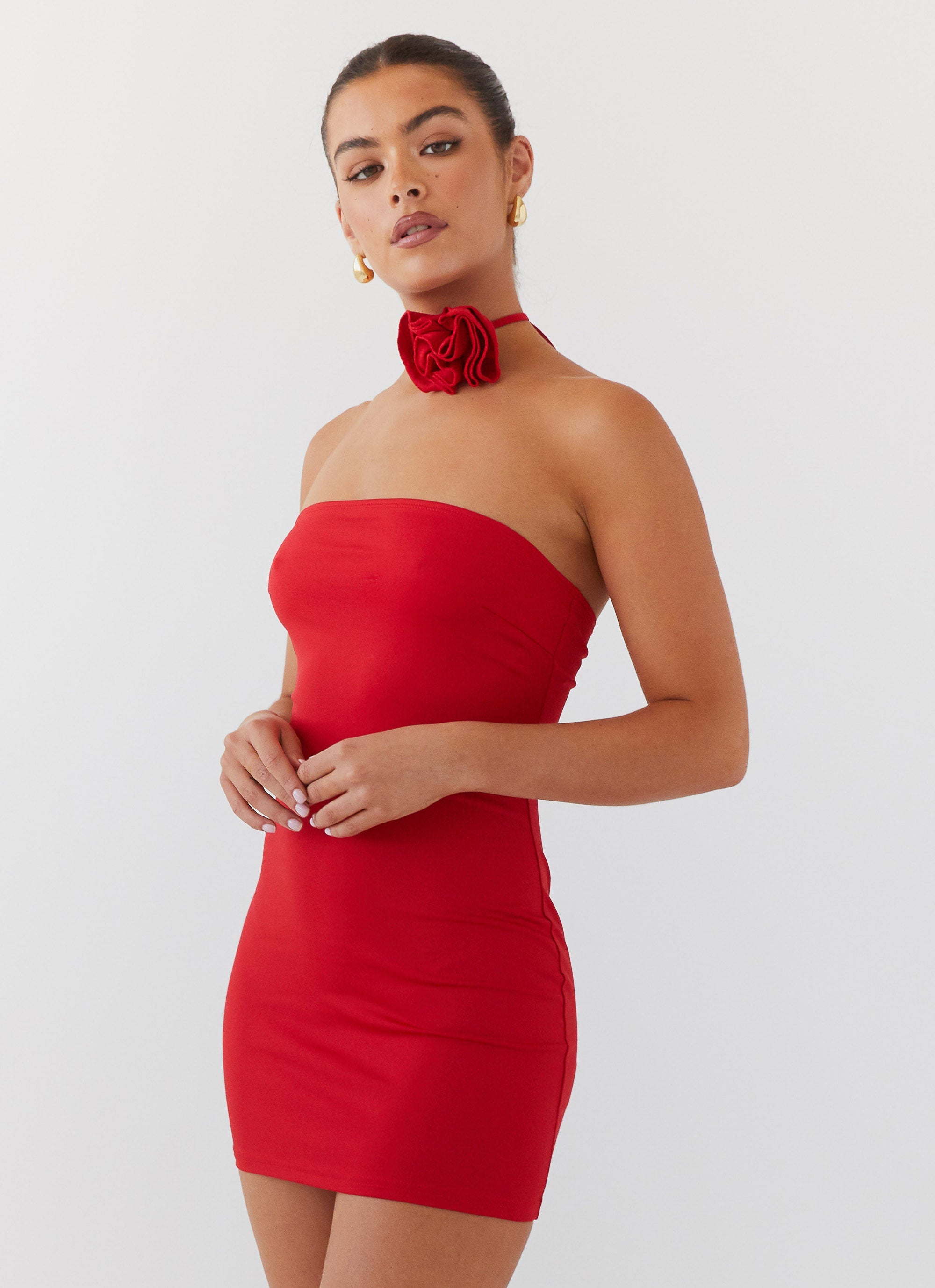 Womens Ruby Glamour Rose Mini Dress in the colour Rouge Red in front of a light grey background