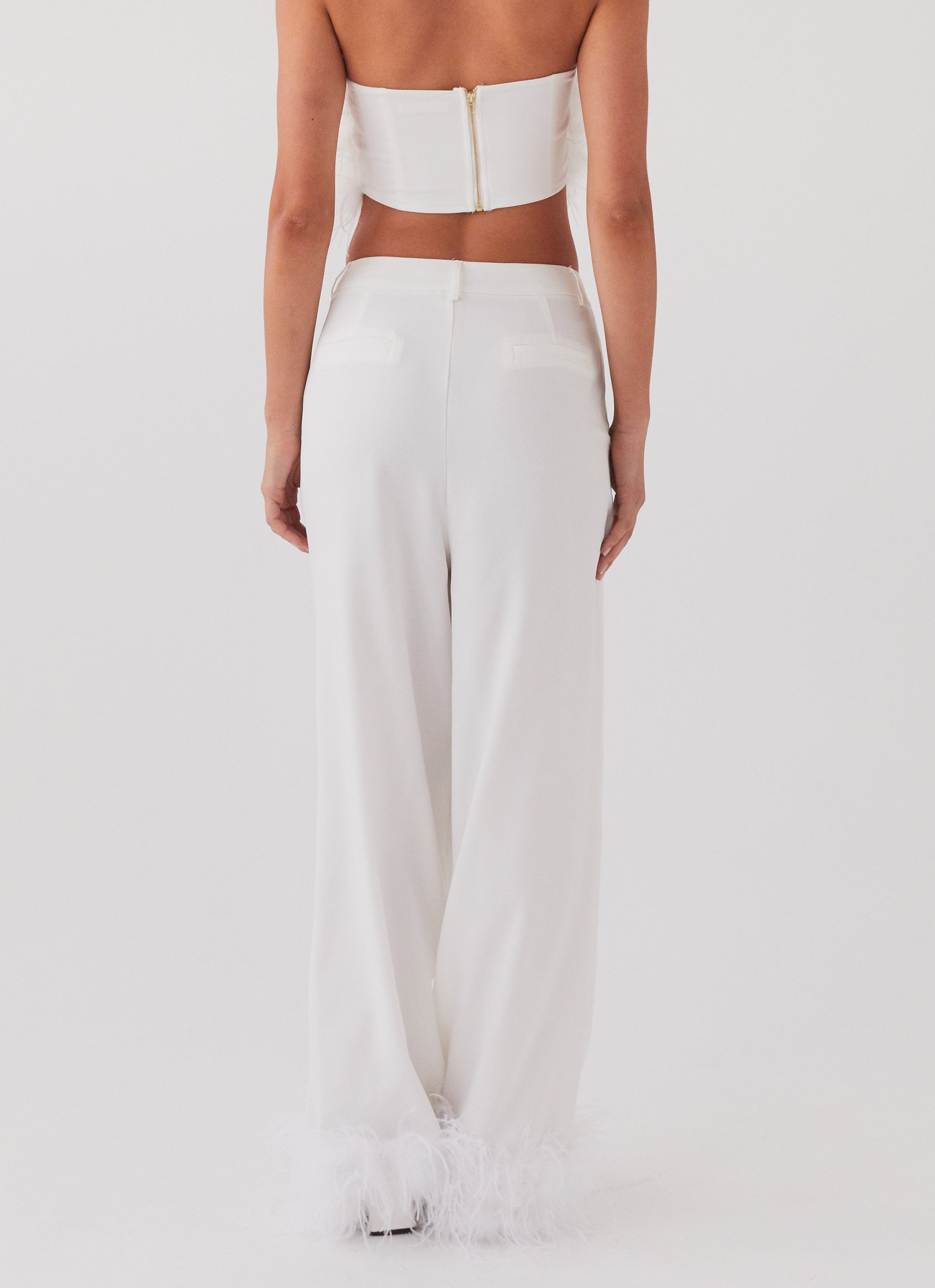 Womens Shake It Off Feather Pants in the colour Snow in front of a light grey background