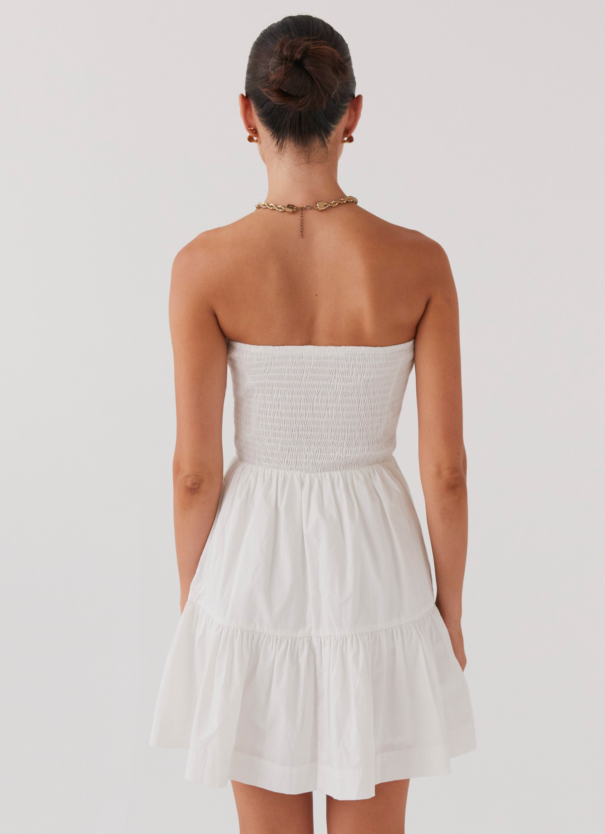 Womens Harper Strapless Mini Dress in the colour White in front of a light grey background