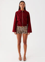 Womens Right Direction Oversized Bomber Jacket in the colour Deep Red in front of a light grey background