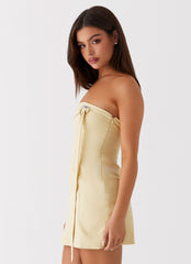 Womens Saskia Mini Dress in the colour Yellow in front of a light grey background