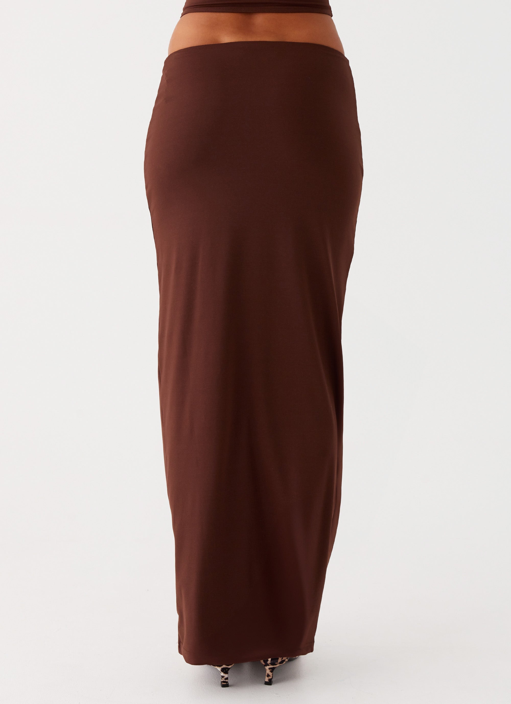 Womens Solace Soul Maxi Skirt in the colour Chocolate in front of a light grey background