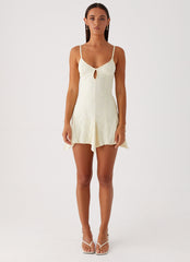 Womens Surry Mini Dress in the colour Yellow in front of a light grey background