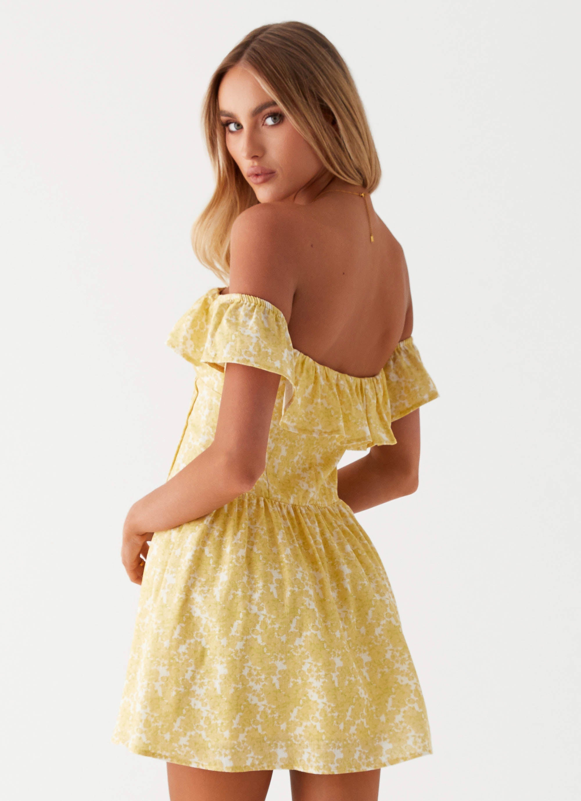 Womens Tarryn Mini Dress in the colour Yellow Floral in front of a light grey background